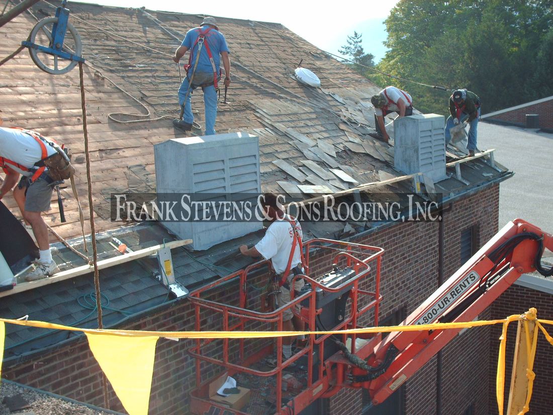 Asphalt shingle roof replacement in progress