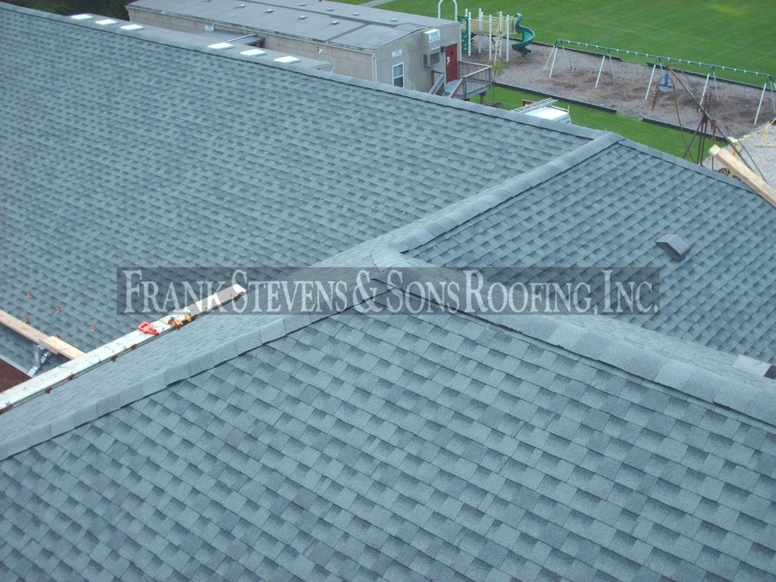 GAF shingle installation with new ridge caps