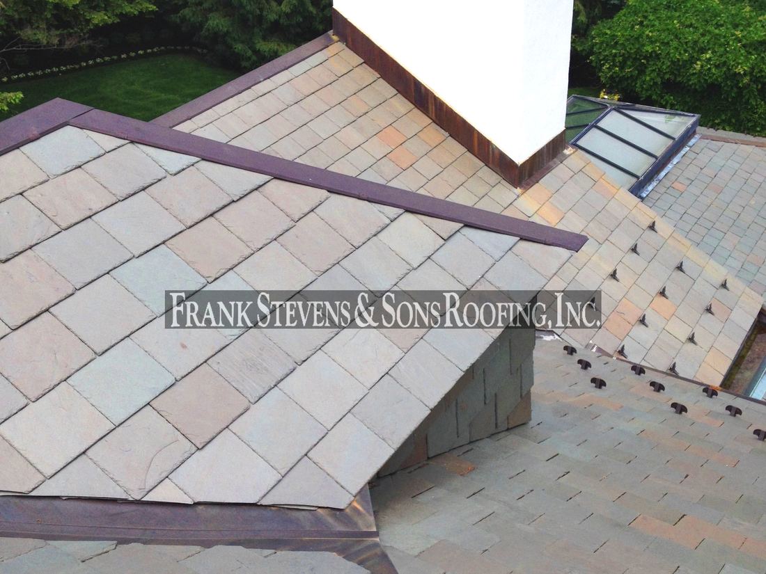 Slate roof with copper valleys and ridges