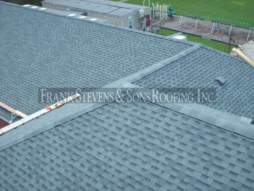 GAF shingle installation with new ridge caps